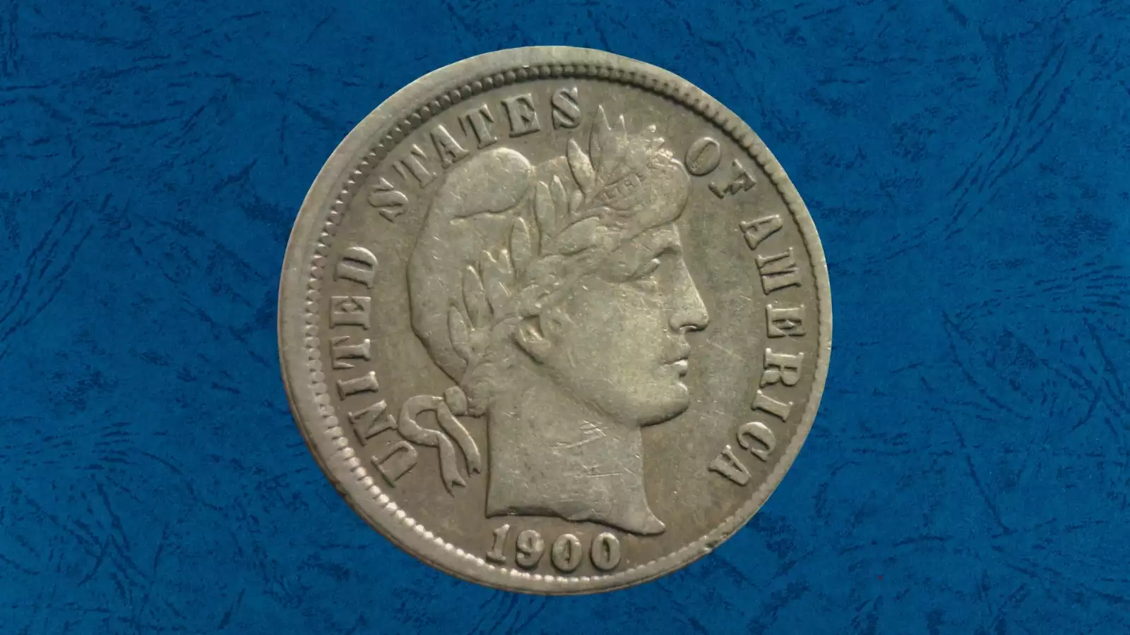 1900 Barber dime with off-center strike showing design shifted with blank crescent of planchet on one side